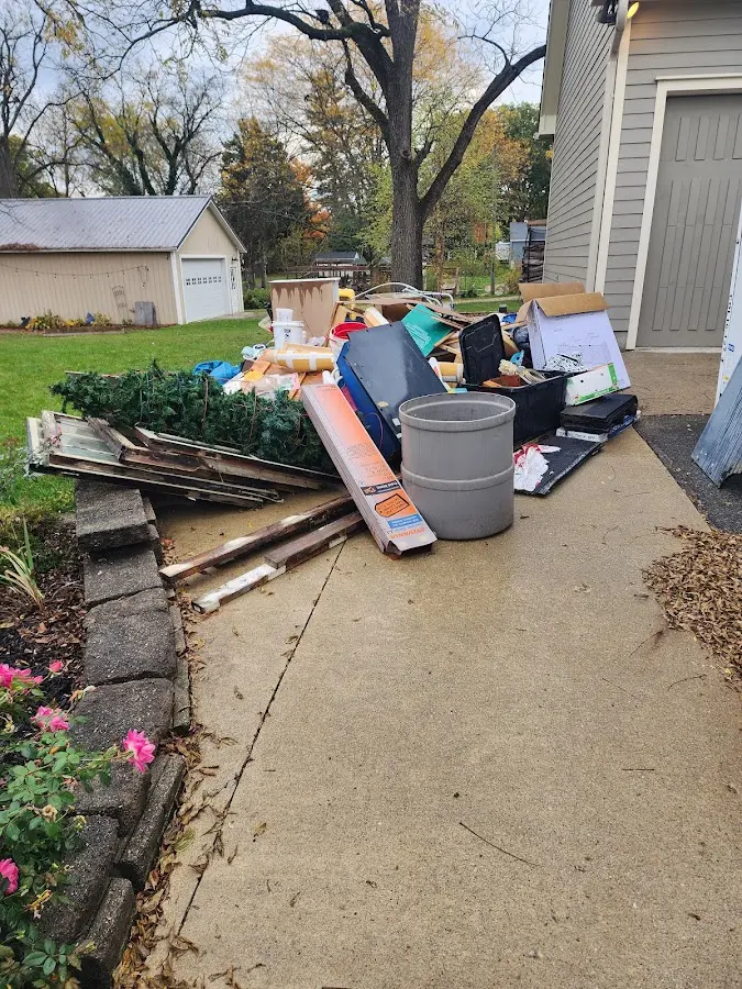 Dumpster being loaded with debris for Residential Dumpster Rental in Chillum